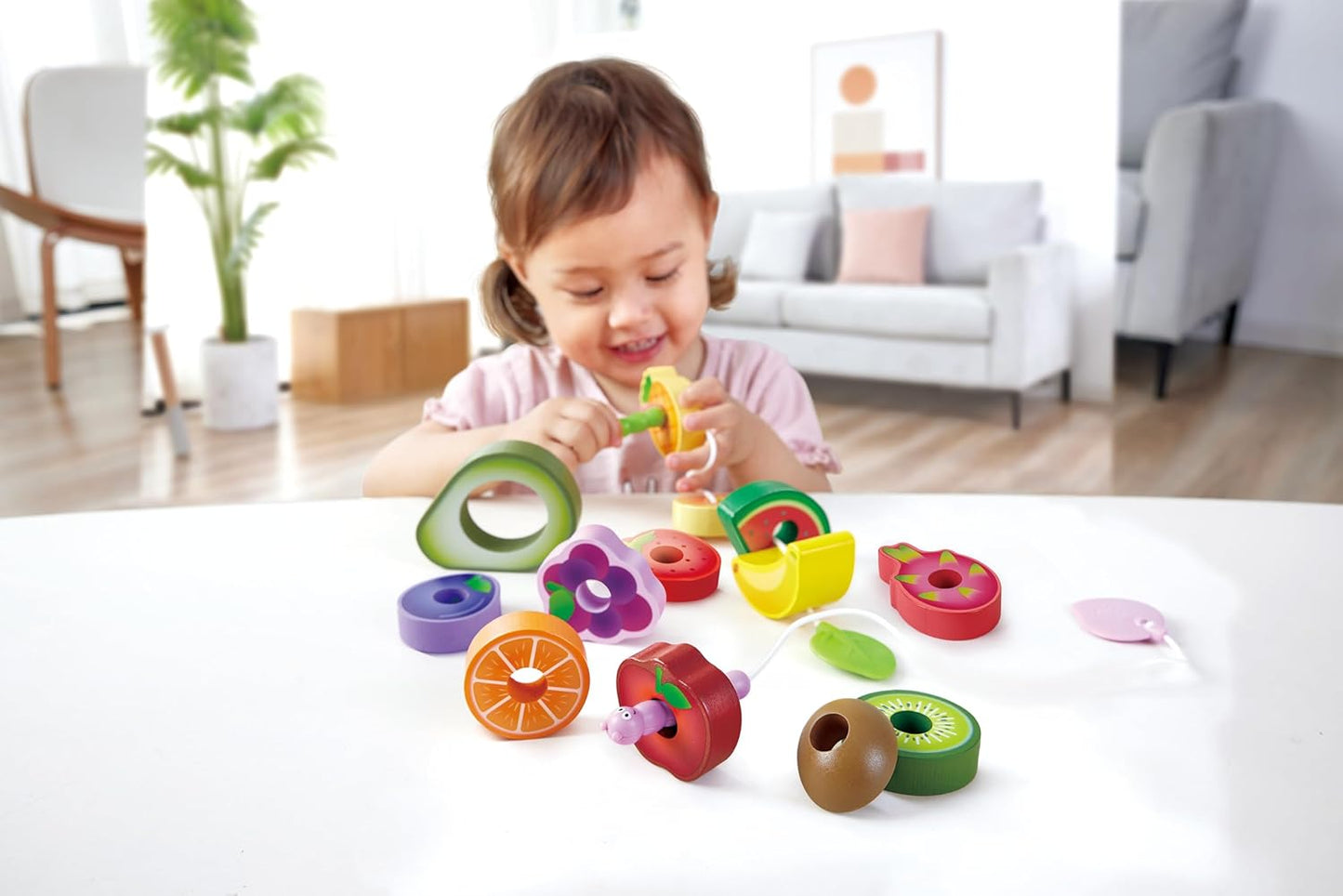 Juego de enhebrar frutas